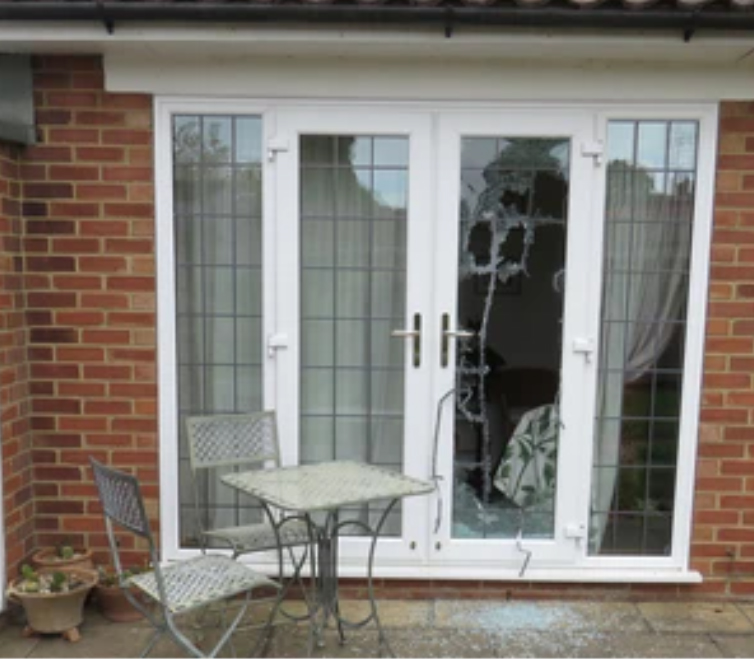 Smashed glazed door awaiting emergency glass replacement