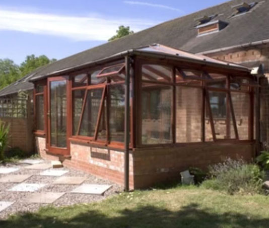 Timber-framed conservatory extension to a home