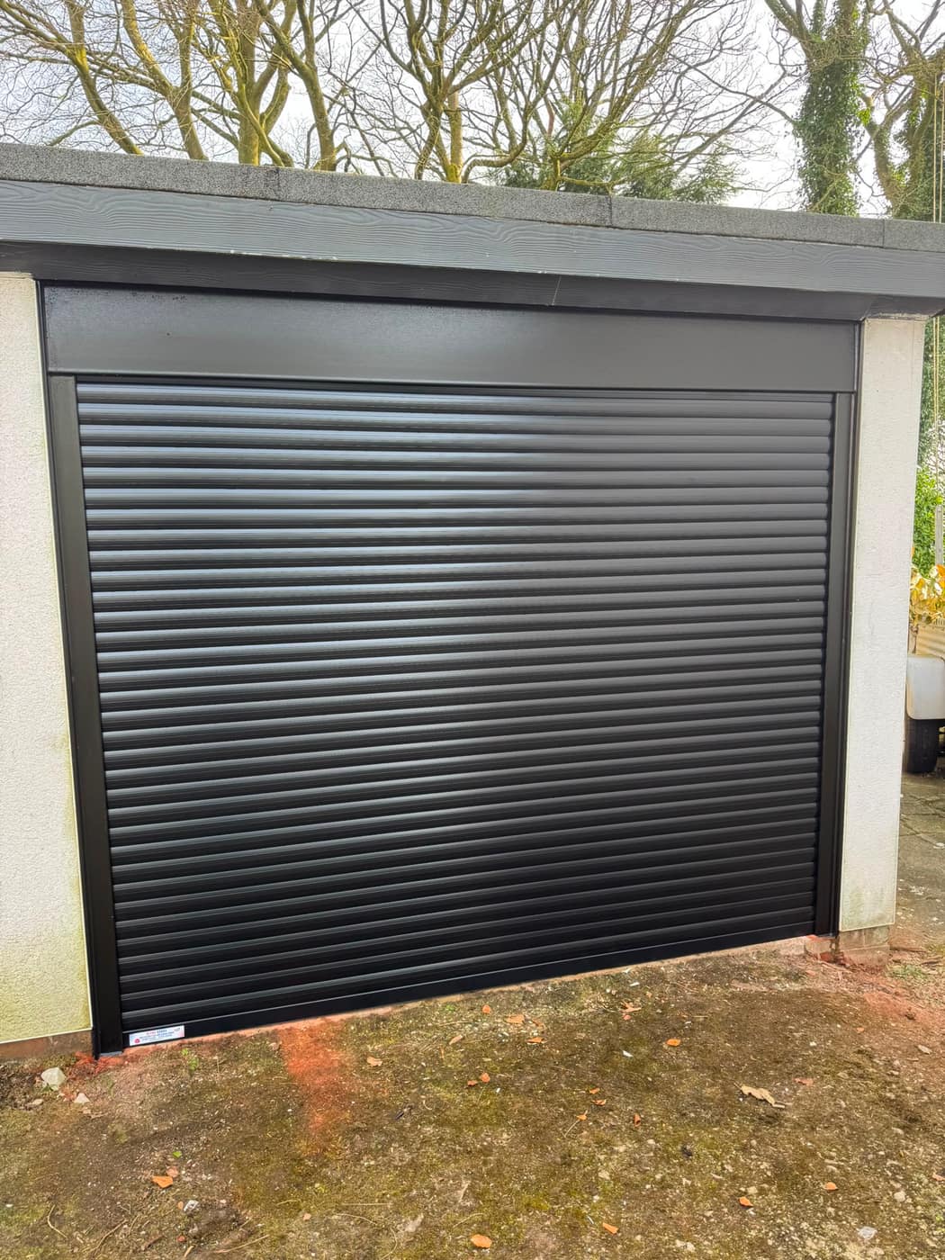 New black insulated roller shutter fitted to the garage