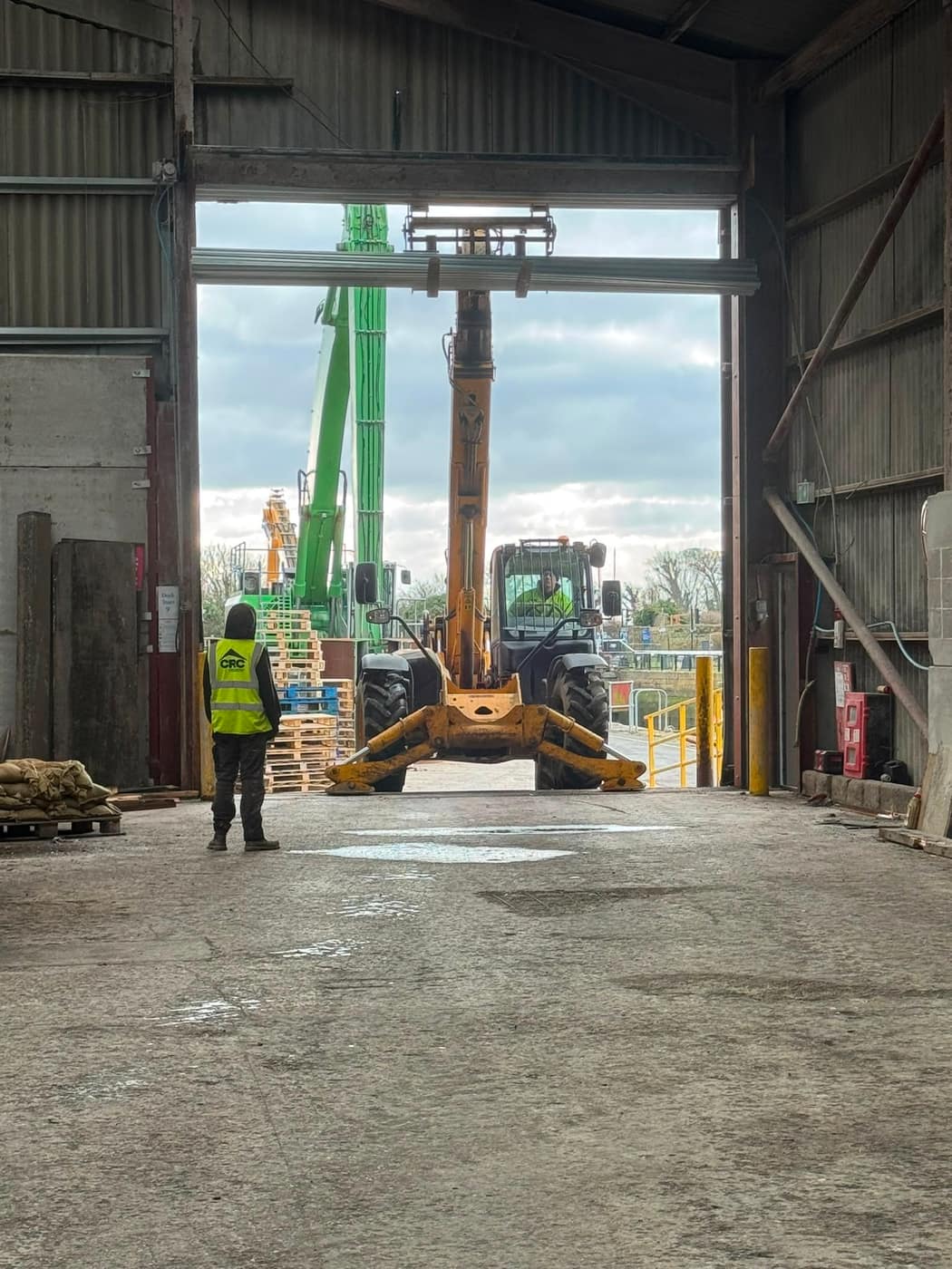 Large industrial door opening on a working warehouse