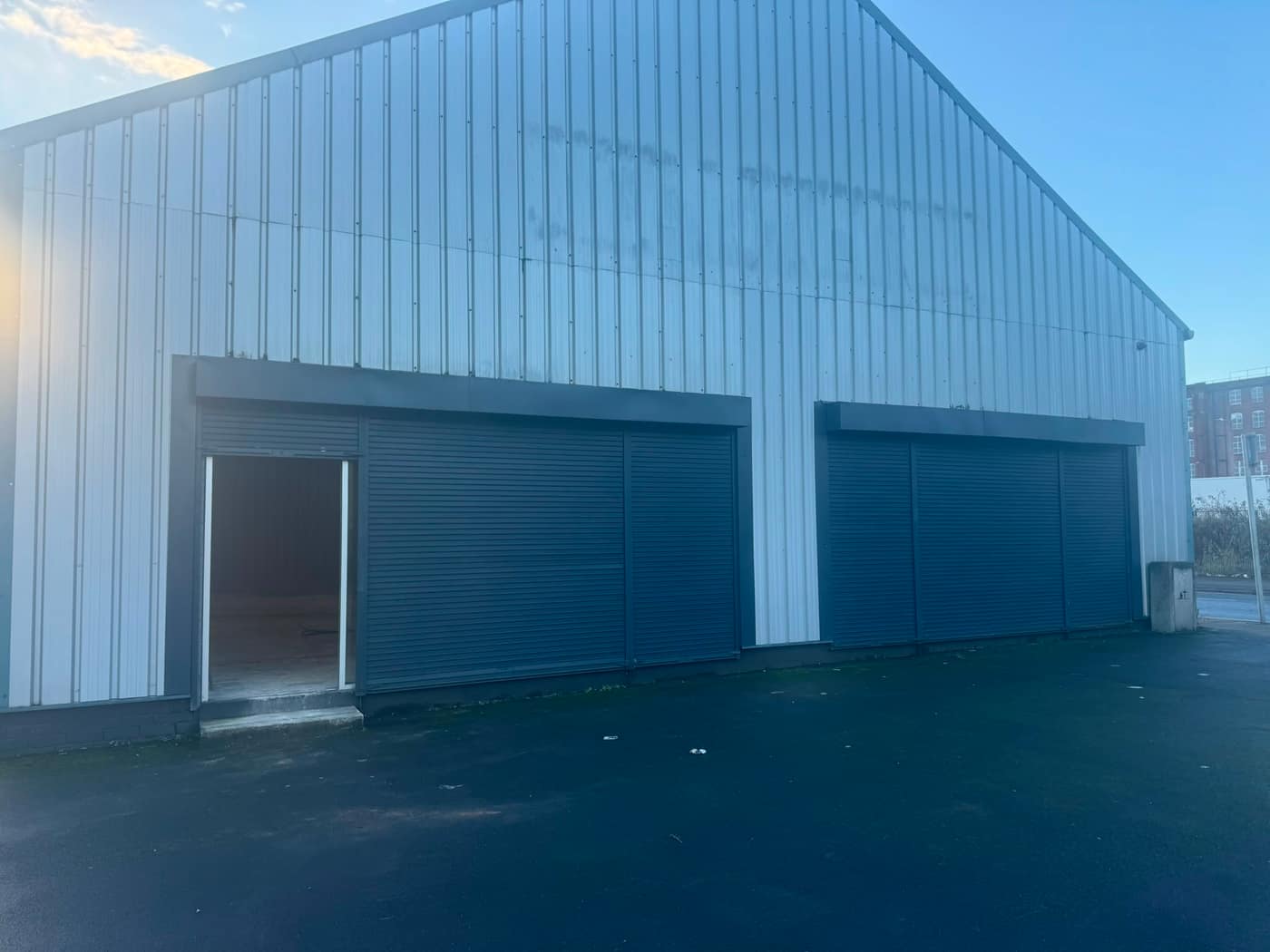 Twin insulated industrial roller shutters on a commercial warehouse