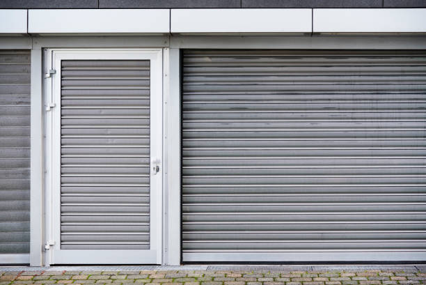 Grey roller shutters on a commercial frontage
