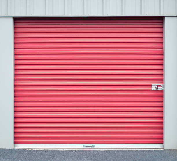 Red roller shutter door on a commercial unit