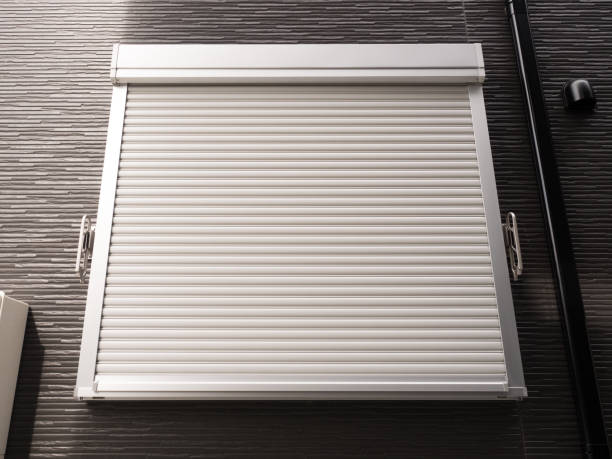 White insulated roller shutter on a garage