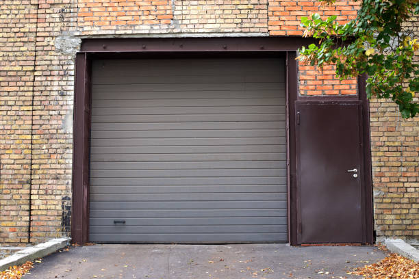 Brown roller shutter on a brick garage