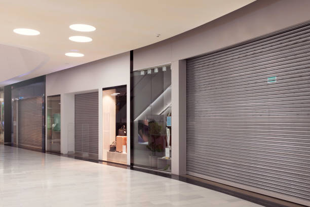 Security shutters inside a shopping centre unit