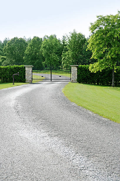 Electric estate gates at the end of a sweeping drive