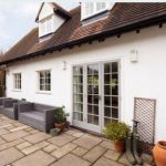 Home with new white uPVC windows and French doors